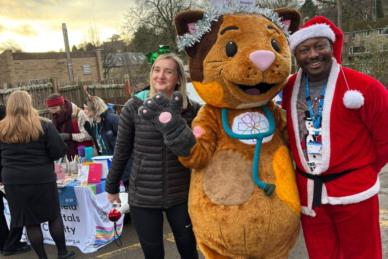 People smiling in Christmas and running gear at charity event