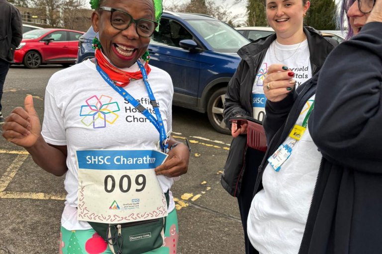 People smiling in Christmas and running gear at charity event